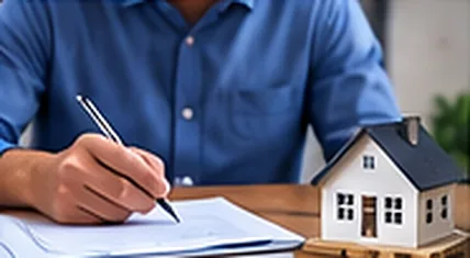 A person reviewing and signing mortgage documents
