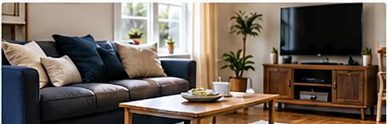 A furnished living room with a sofa, coffee table, and television, representing personal property coverage